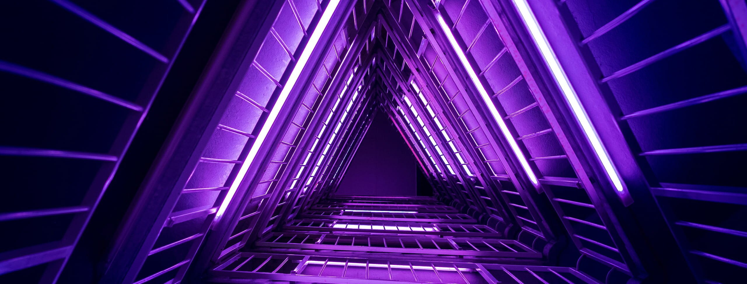 Staircase lined with purple lights