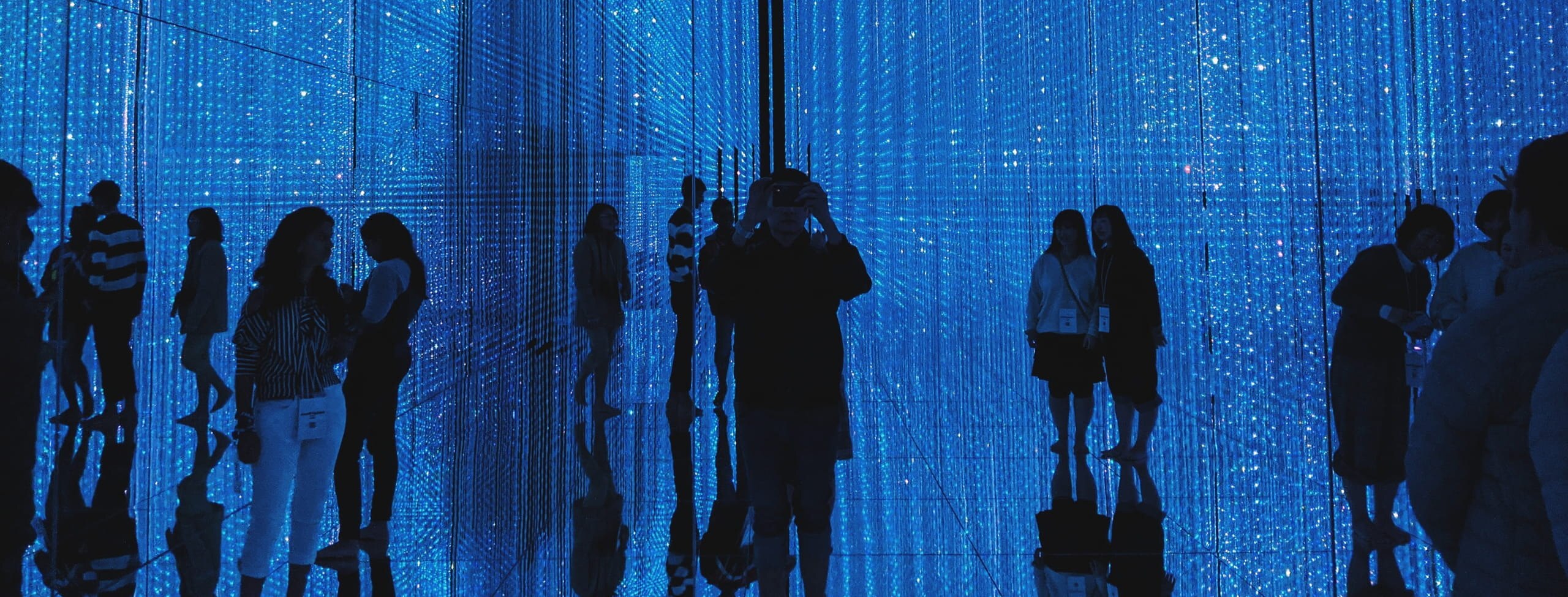 People surrounded by blue lights
