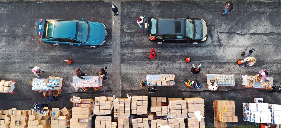 Aerial view of people bringing food and supplies to help in a crisis