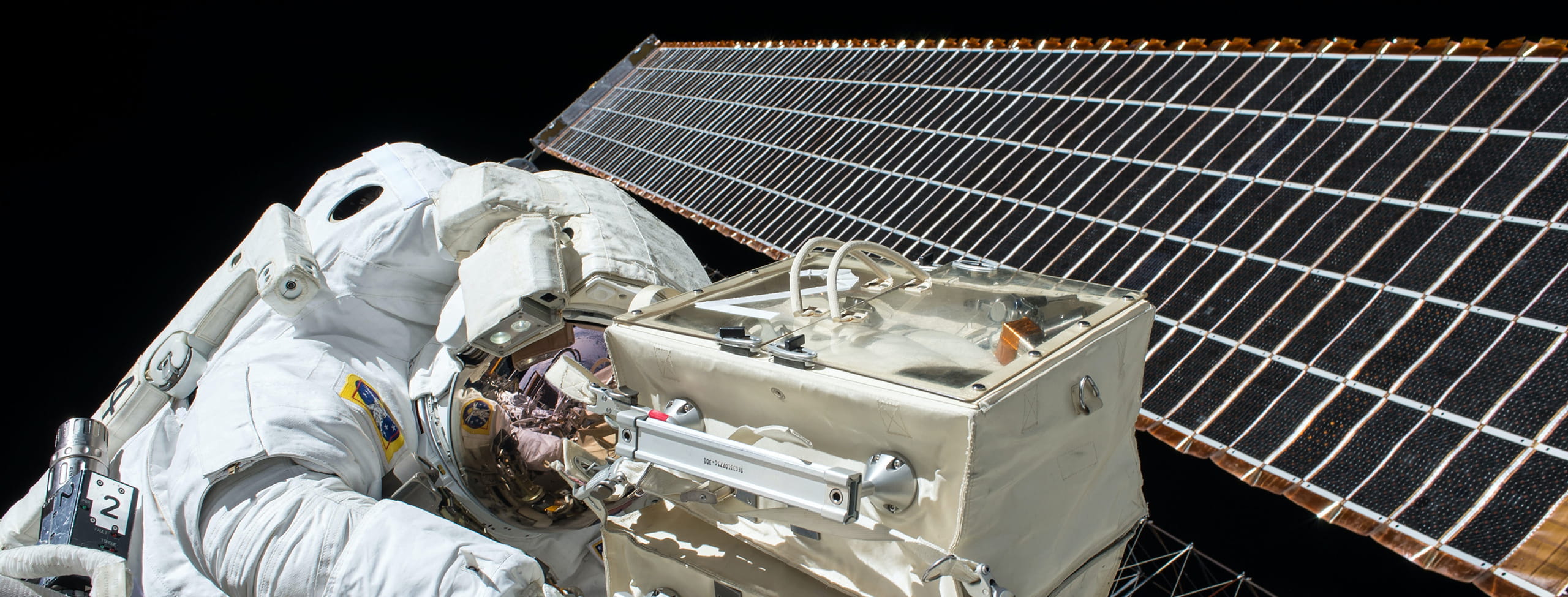 NASA astronaut working on space satellite