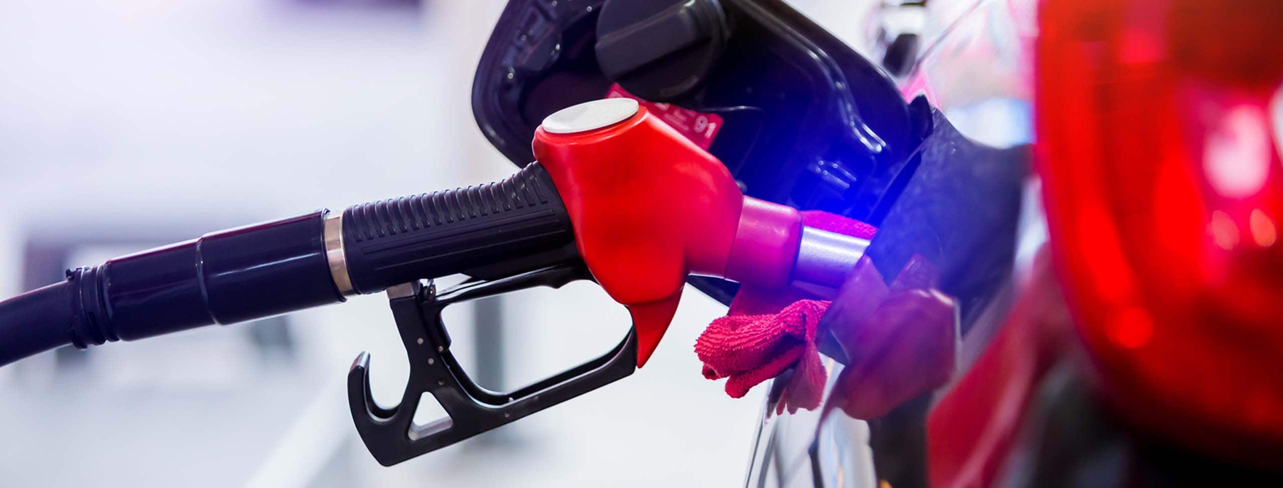 Red_Gas_Pump_Refilling_At_Gas_Station_S_2308-X3