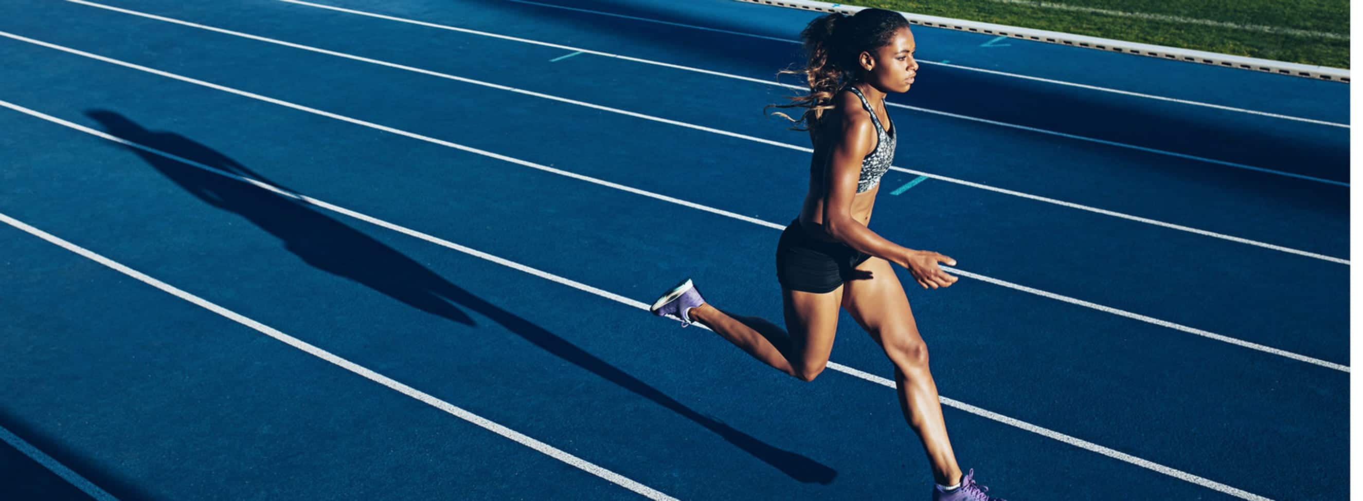 Woman_Athlete_Running_on_Racetrack_S_0627