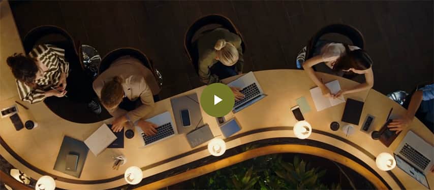 Still from 50 leaders of change video showing curved desks from above